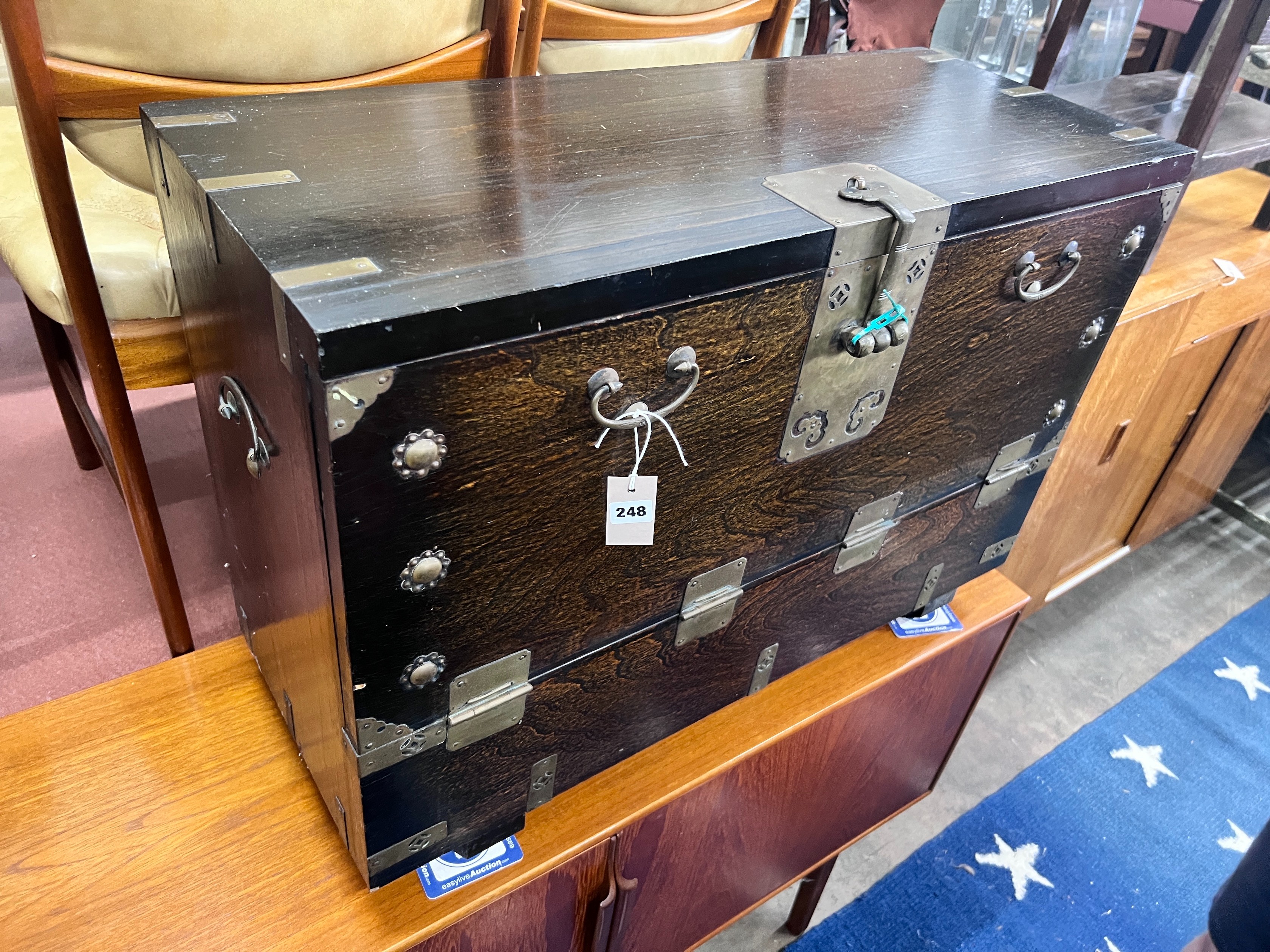 A Korean brass mounted ebonised wood trunk, width 85cm *Please note the sale commences at 9am.
